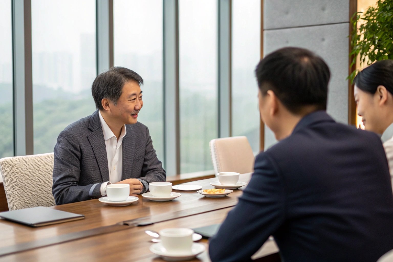 Executives discussing supply chain strategy over coffee