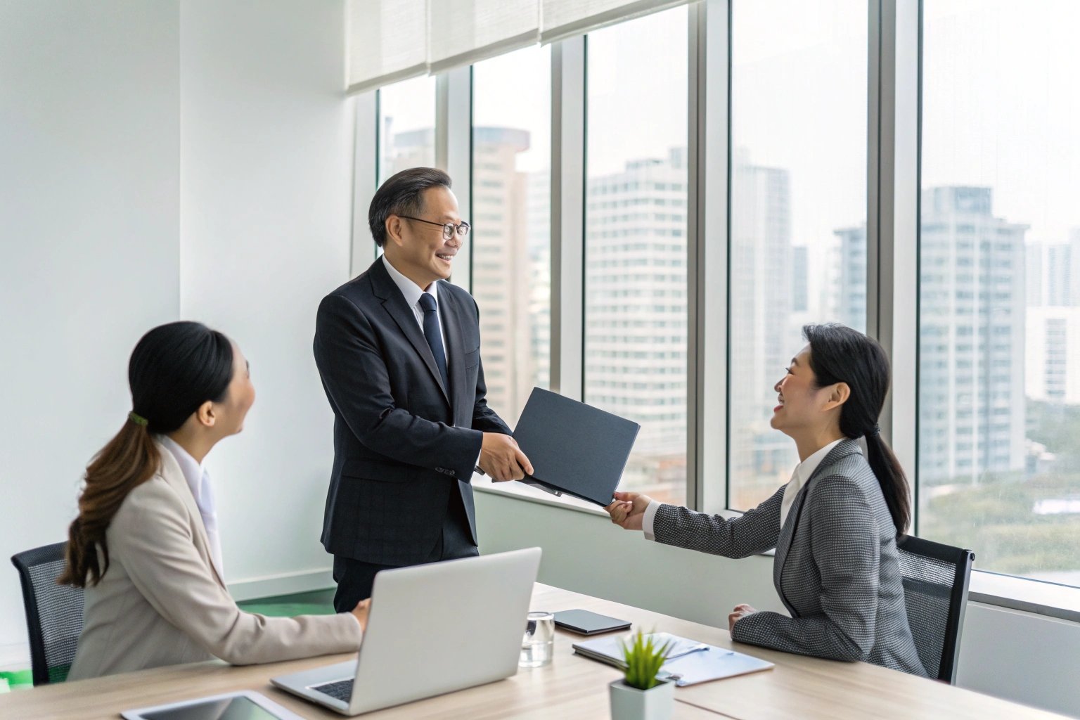Corporate Exchange Business team in a modern office exchanging documents during a corporate meeting.